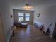 Bright sitting room featuring hardwood floors and ample natural light at 10066 Corso Milano Dr, Tampa, FL 33625