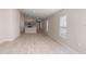 Bright and spacious living room with light wood-look floors and neutral walls at 12125 Cattleside Dr, Riverview, FL 33579