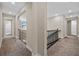 Upstairs hallway with carpet and wrought iron railing at 4281 Frontera Ln, Wesley Chapel, FL 33543