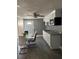 Modern kitchen with white cabinets and granite counters at 4509 Tidal Pond Rd, New Port Richey, FL 34652
