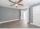 Well-lit bedroom featuring wood-look flooring at 4509 Tidal Pond Rd, New Port Richey, FL 34652