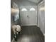Bright entryway with double doors and hardwood flooring at 4509 Tidal Pond Rd, New Port Richey, FL 34652