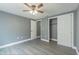 Spacious bedroom with gray walls and wood-look flooring at 4509 Tidal Pond Rd, New Port Richey, FL 34652