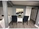 Small dining area with glass table and chairs at 4509 Tidal Pond Rd, New Port Richey, FL 34652