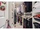 Large walk-in closet with ample shelving and hanging space at 2714 Chestnut Creek Pl, Brandon, FL 33510