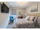 Bright bedroom featuring a comfy bed and a stylish chair at 2714 Chestnut Creek Pl, Brandon, FL 33510