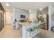 Open-concept kitchen with island and view into living room and hallway at 2714 Chestnut Creek Pl, Brandon, FL 33510