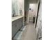 Clean bathroom with double sinks and a separate toilet area at 2714 Chestnut Creek Pl, Brandon, FL 33510