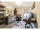 Well-lit home office with built-in shelving and a work desk at 2714 Chestnut Creek Pl, Brandon, FL 33510