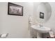 Small bathroom with pedestal sink and large mirror at 2714 Chestnut Creek Pl, Brandon, FL 33510