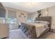 Main bedroom with tufted headboard and neutral color scheme at 2714 Chestnut Creek Pl, Brandon, FL 33510