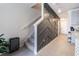 Modern entryway with stylish staircase and geometric wall design at 2714 Chestnut Creek Pl, Brandon, FL 33510
