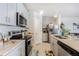 Modern kitchen featuring stainless steel appliances and granite countertops at 2714 Chestnut Creek Pl, Brandon, FL 33510