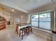 Small breakfast nook with granite countertop and two barstools at 604 Masterpiece Dr # 604, Sun City Center, FL 33573