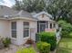 Well-maintained house with landscaped yard and walkway at 604 Masterpiece Dr # 604, Sun City Center, FL 33573