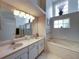 Double vanity bathroom with large soaking tub and shower at 604 Masterpiece Dr # 604, Sun City Center, FL 33573
