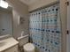 Clean bathroom with a shower/tub combo and nautical decor at 604 Masterpiece Dr # 604, Sun City Center, FL 33573