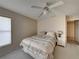 Bright bedroom with a ceiling fan and ample closet space at 604 Masterpiece Dr # 604, Sun City Center, FL 33573