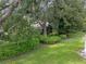 Lush landscaping and mature trees in the backyard at 604 Masterpiece Dr # 604, Sun City Center, FL 33573