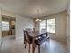 Spacious dining area with wood table and bench seating, offering ample natural light at 604 Masterpiece Dr # 604, Sun City Center, FL 33573
