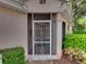 View of a screened-in porch entrance to the home at 604 Masterpiece Dr # 604, Sun City Center, FL 33573