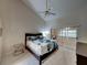 Large bedroom with sliding glass door to home office at 604 Masterpiece Dr # 604, Sun City Center, FL 33573