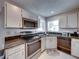 Modern kitchen with stainless steel appliances and granite countertops at 604 Masterpiece Dr # 604, Sun City Center, FL 33573