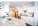 Modern kitchen with granite countertops and white cabinets at 707 S Gulfstream Ave # 602, Sarasota, FL 34236