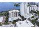 Aerial view of a condo building with pool and water views at 707 S Gulfstream Ave # 602, Sarasota, FL 34236