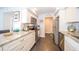 Well-equipped kitchen featuring granite counters and white cabinets at 707 S Gulfstream Ave # 602, Sarasota, FL 34236