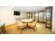 Game room with a round table, chairs, and a bookcase at 707 S Gulfstream Ave # 602, Sarasota, FL 34236