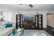 Living room with large TV, ample shelving, and a coastal color scheme at 707 S Gulfstream Ave # 602, Sarasota, FL 34236