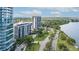 Aerial view of a condo building near the water, showing surrounding buildings and roads at 707 S Gulfstream Ave # 602, Sarasota, FL 34236