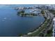 Aerial view showcasing a marina, waterfront, and city skyline at 707 S Gulfstream Ave # 602, Sarasota, FL 34236
