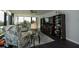 Relaxing living area featuring a large TV, comfortable seating, and built-in shelving at 707 S Gulfstream Ave # 602, Sarasota, FL 34236