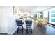 Eat-in kitchen with breakfast bar and view to dining area at 707 S Gulfstream Ave # 602, Sarasota, FL 34236