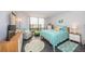 Bright bedroom with a queen-sized bed and teal bedding at 707 S Gulfstream Ave # 602, Sarasota, FL 34236