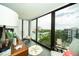 Peaceful sunroom with relaxing seating and city views at 707 S Gulfstream Ave # 602, Sarasota, FL 34236