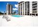 Community pool with plenty of lounge chairs at 707 S Gulfstream Ave # 602, Sarasota, FL 34236