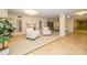 Lobby sitting area with comfortable armchairs and bookcase at 707 S Gulfstream Ave # 602, Sarasota, FL 34236