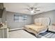 Spacious bedroom with a large bed, ceiling fan, and stylish decor at 240 Windward Psge # 605, Clearwater Beach, FL 33767