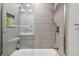 Modern bathroom with gray tile, a walk-in shower, and white countertop at 240 Windward Psge # 605, Clearwater Beach, FL 33767
