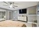 Bedroom with large dresser, TV, and window coverings at 240 Windward Psge # 605, Clearwater Beach, FL 33767