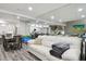 Open concept dining area with hardwood floors and modern table and chairs at 240 Windward Psge # 605, Clearwater Beach, FL 33767