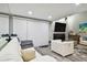 Living room with white couches and a view into the living area at 240 Windward Psge # 605, Clearwater Beach, FL 33767