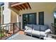 Relaxing balcony with seating and access to sliding doors at 240 Windward Psge # 605, Clearwater Beach, FL 33767