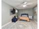 Spacious bedroom with a queen bed and ceiling fan at 240 Windward Psge # 605, Clearwater Beach, FL 33767