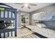 Bedroom with two bunk beds, a ceiling fan and access to a bathroom at 240 Windward Psge # 605, Clearwater Beach, FL 33767