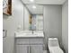 Updated bathroom with gray walls, quartz countertop, and modern vanity at 240 Windward Psge # 605, Clearwater Beach, FL 33767