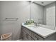 Modern bathroom with gray tile, a walk-in shower, and white countertop at 240 Windward Psge # 605, Clearwater Beach, FL 33767